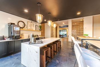 A modern clubhouse with a long island in the middle